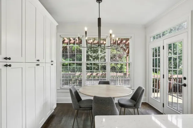a view of a dining room with furniture window and outside view
