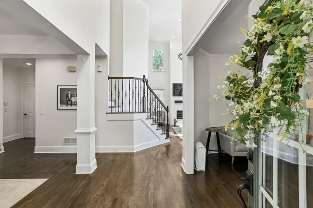 a view of entryway with wooden floor and stairs