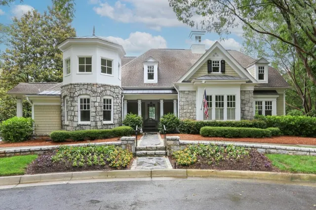 a view of a swimming pool with lounge chairs
