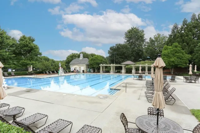 a view of a park that has a sign board on it