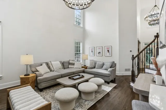 a living room with furniture and a lamp