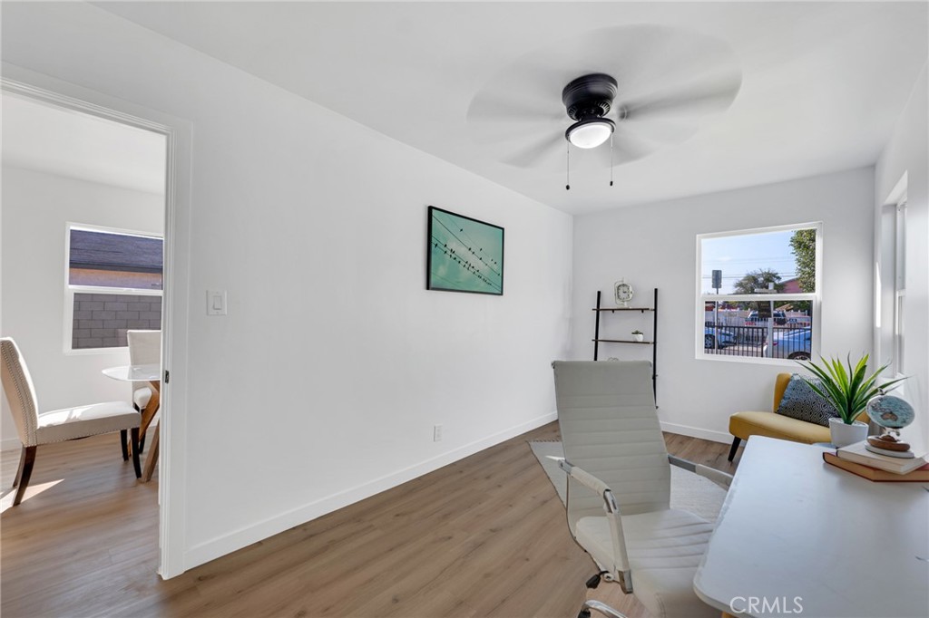 2124 East Oris Street Compton, CA 90222 - Photo 11 of 20 a view of a livingroom with furniture and a potted plant