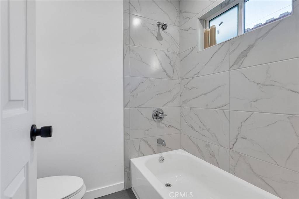 2124 East Oris Street Compton, CA 90222 - Photo 12 of 20 a bathroom with a white tub