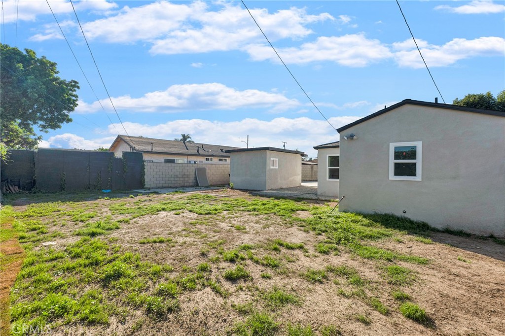 2124 East Oris Street Compton, CA 90222 - Photo 16 of 20 a view of a house with a yard