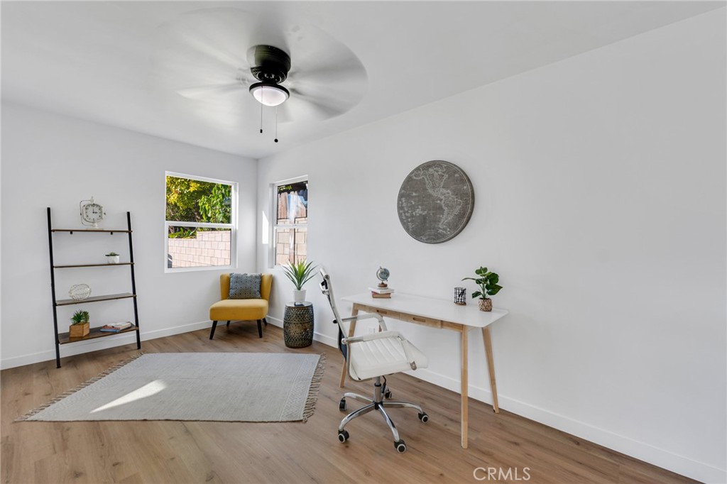 2124 East Oris Street Compton, CA 90222 - Photo 10 of 20 a living room with furniture and a window