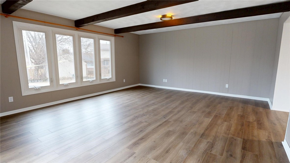 4153 Buckingham Drive Decatur, IL 62526 - Photo 12 of 34 a view of an empty room with wooden floor and a window