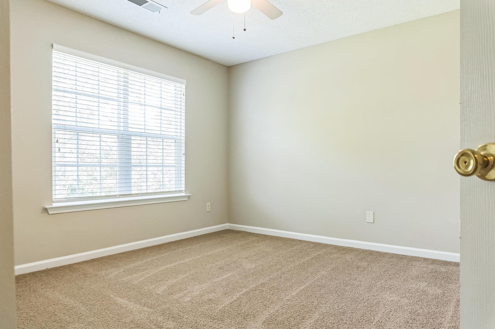 5368 Milton Ridge Drive Arlington, TN 38002 - Photo 7 of 15 Empty room with carpet floors, baseboards, and a ceiling fan