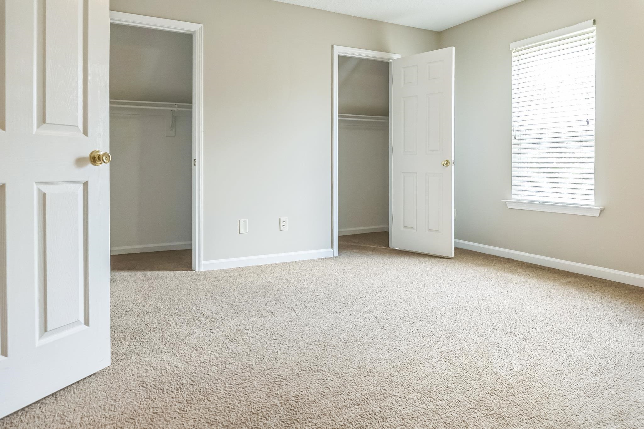 5368 Milton Ridge Drive Arlington, TN 38002 - Photo 9 of 15 Unfurnished bedroom featuring carpet flooring, baseboards, and multiple closets