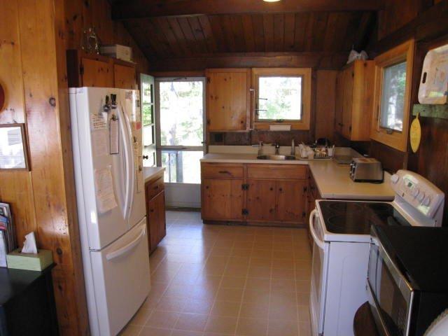 49 King Phillip Road Wellfleet, MA 02667 - Photo 18 of 19 a kitchen with sink refrigerator and window