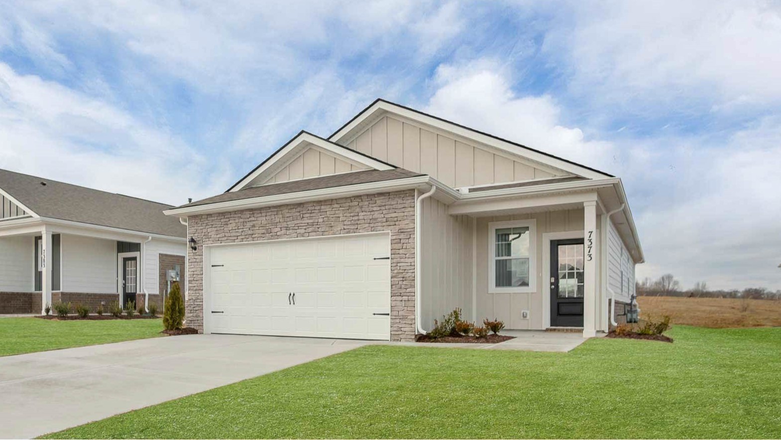 4906 Barnburgh Lane Murfreesboro, TN 37129 - Photo 2 of 11 a front view of a house with a yard and garage