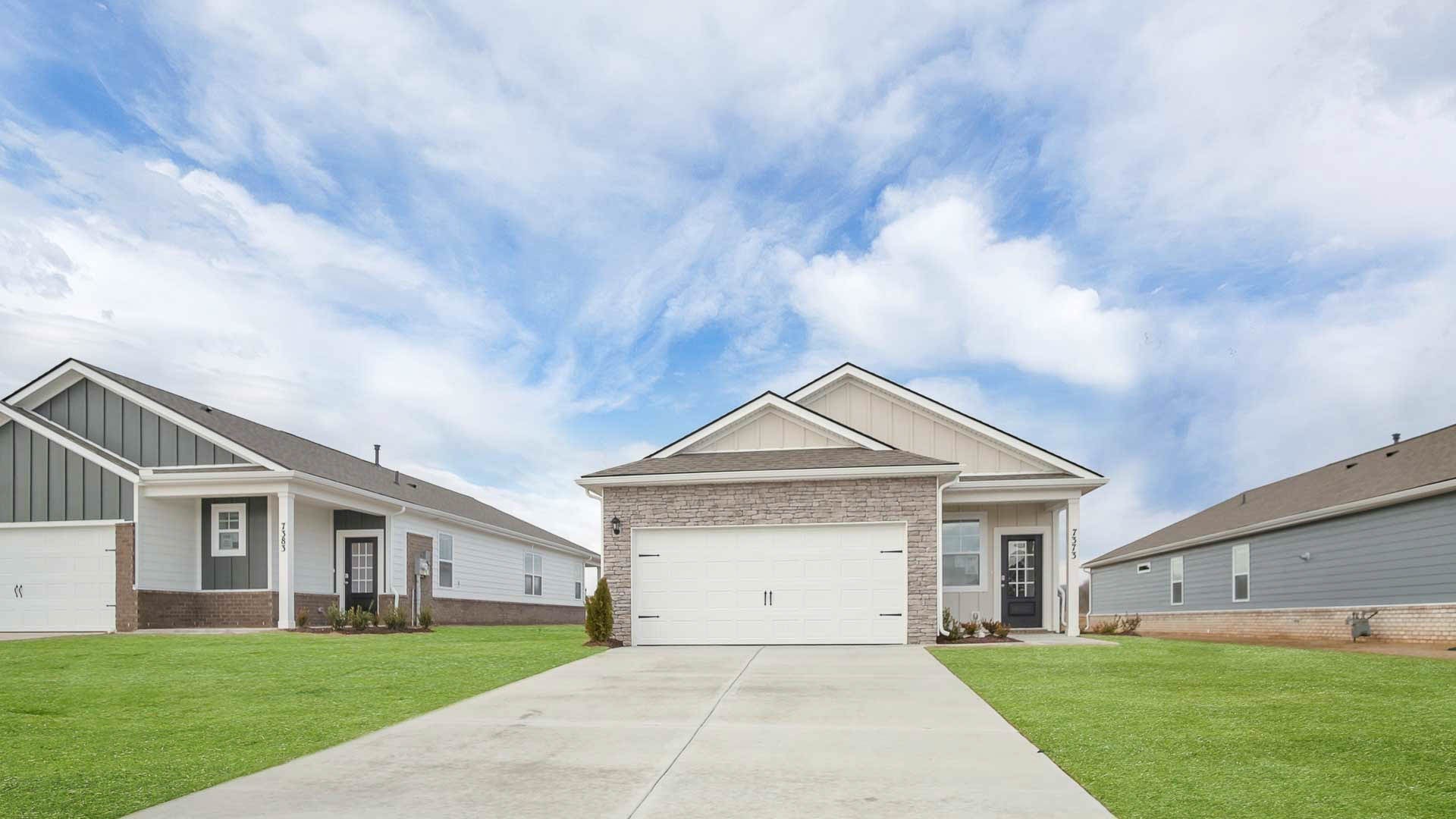 4906 Barnburgh Lane Murfreesboro, TN 37129 - Photo 3 of 11 a front view of a house with a yard and garage