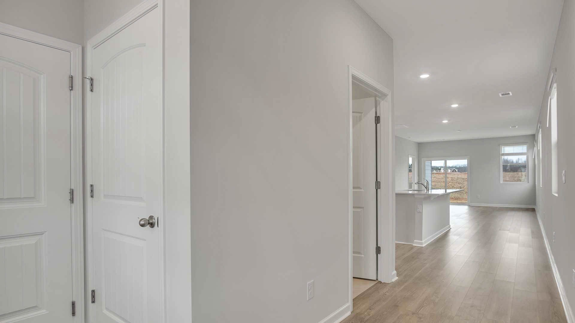 4906 Barnburgh Lane Murfreesboro, TN 37129 - Photo 5 of 11 a view of a hallway with wooden floor windows and chandelier