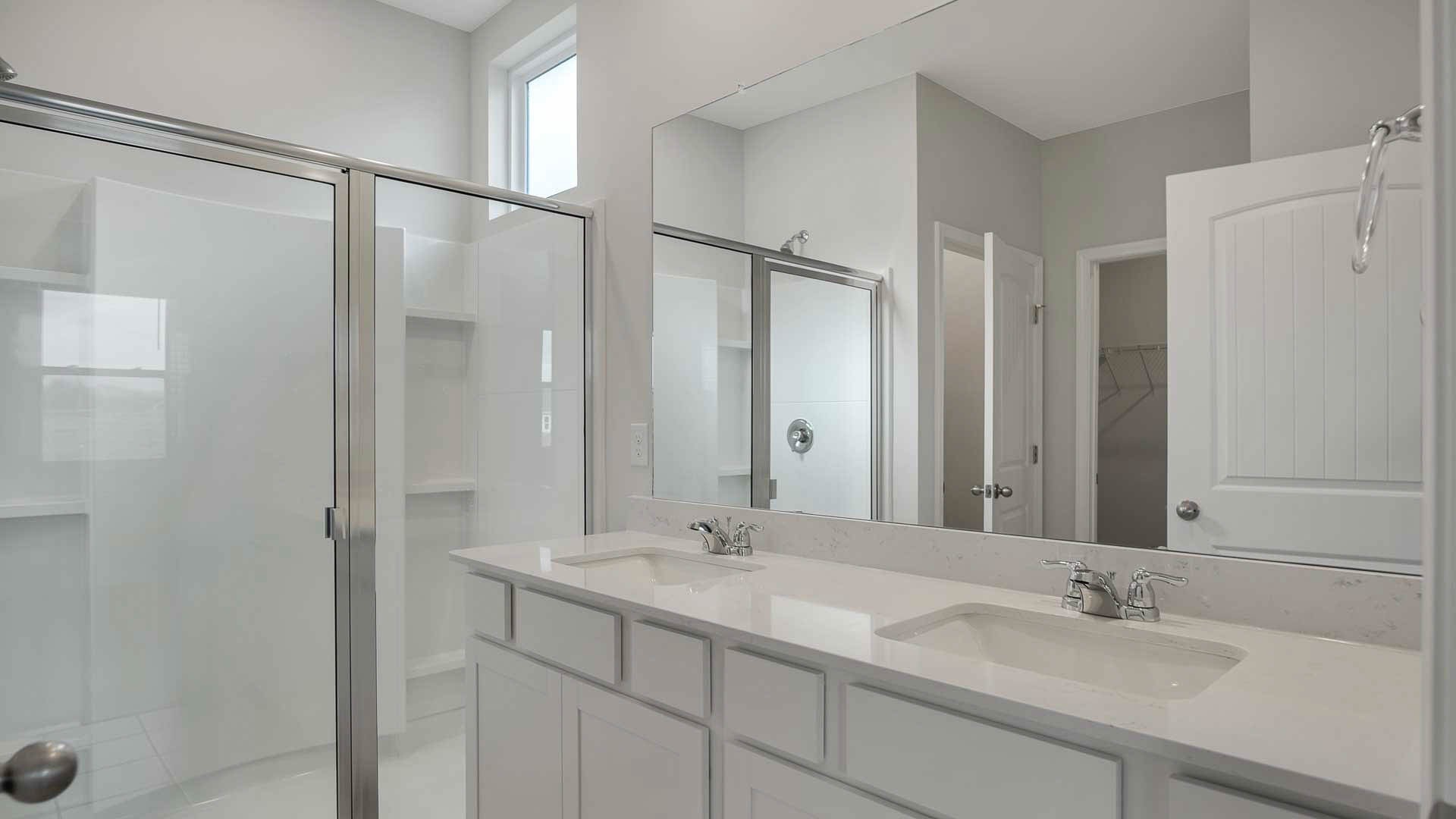 4906 Barnburgh Lane Murfreesboro, TN 37129 - Photo 8 of 11 a bathroom with a granite countertop sink a mirror and a shower