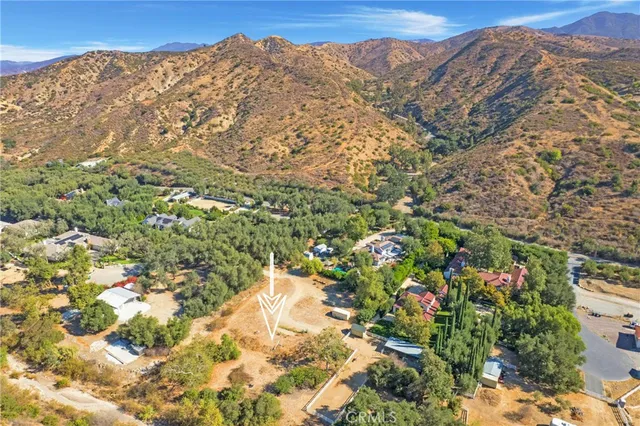 a view of a large building with a mountain in the background