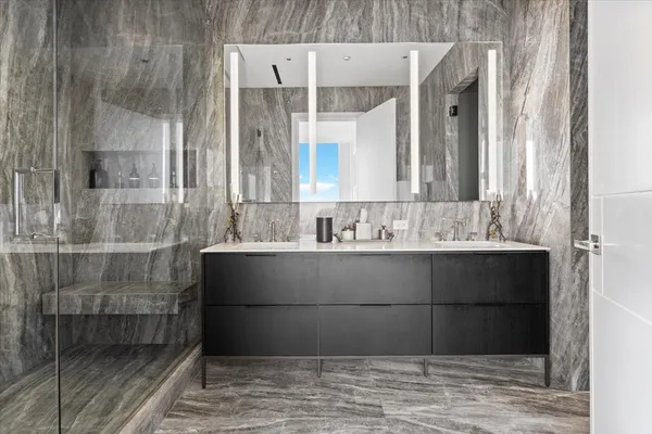 a bathroom with a sink and a mirror