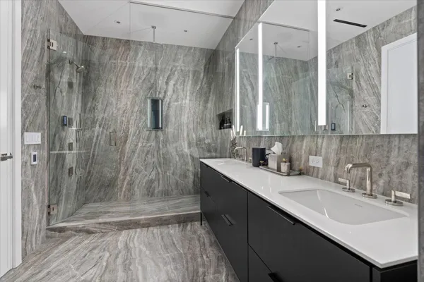 a bathroom with a sink and a mirror