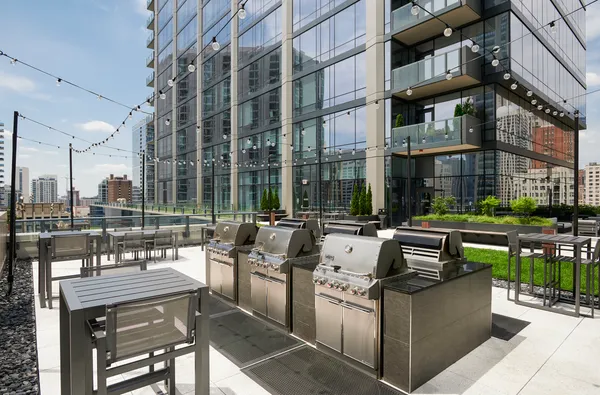 a view of a porch with a floor to ceiling window next to a tall building