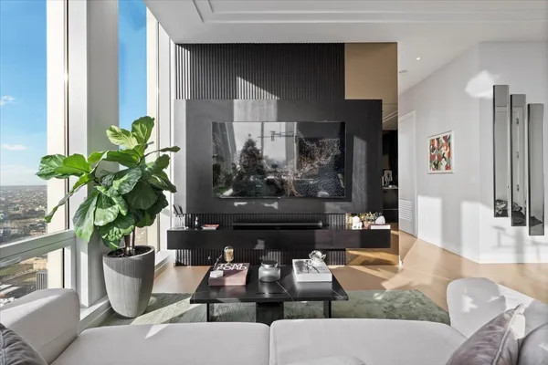 a kitchen with stainless steel appliances kitchen island granite countertop a refrigerator a stove a sink dishwasher with a dining table and chairs