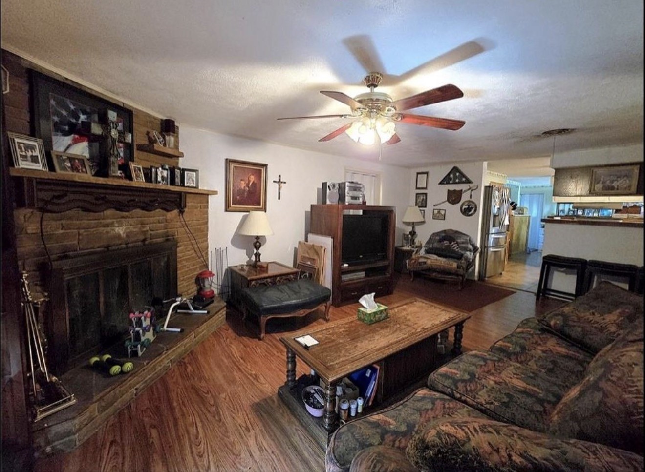 30 North Terrace Drive Point Blank, TX 77364 - Photo 6 of 14 a living room with furniture a flat screen tv and a fireplace