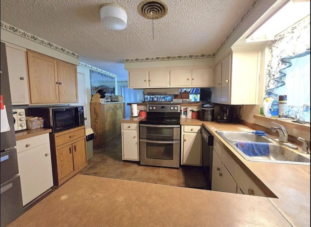 30 North Terrace Drive Point Blank, TX 77364 - Photo 7 of 14 a kitchen with stainless steel appliances granite countertop a stove a sink dishwasher and a refrigerator