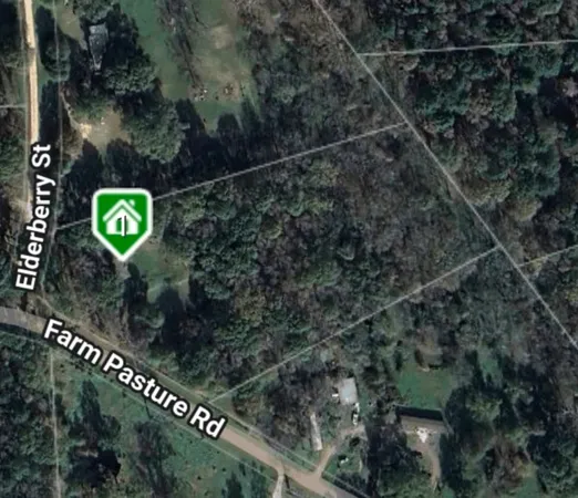 a view of a sign under a tree