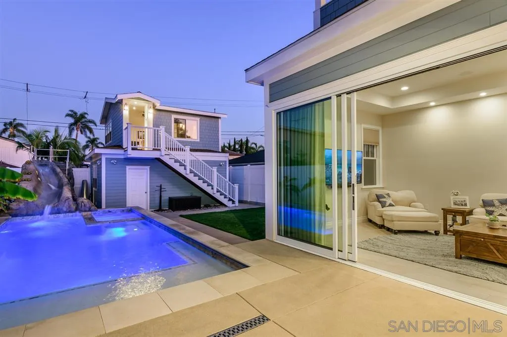 a bedroom with bed and balcony