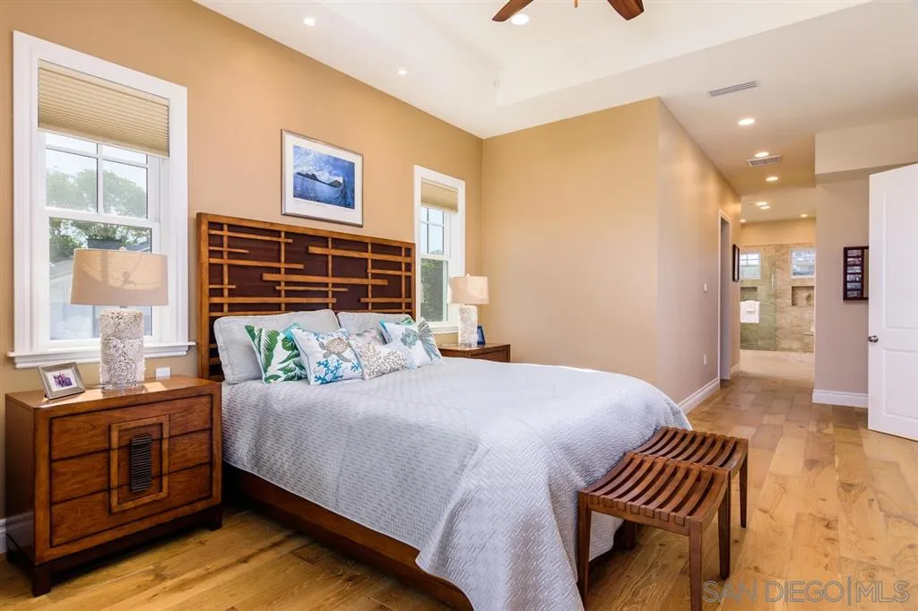 261 E Avenue Coronado, CA 92118 - Photo 11 of 25 a bedroom with a bed and a dresser