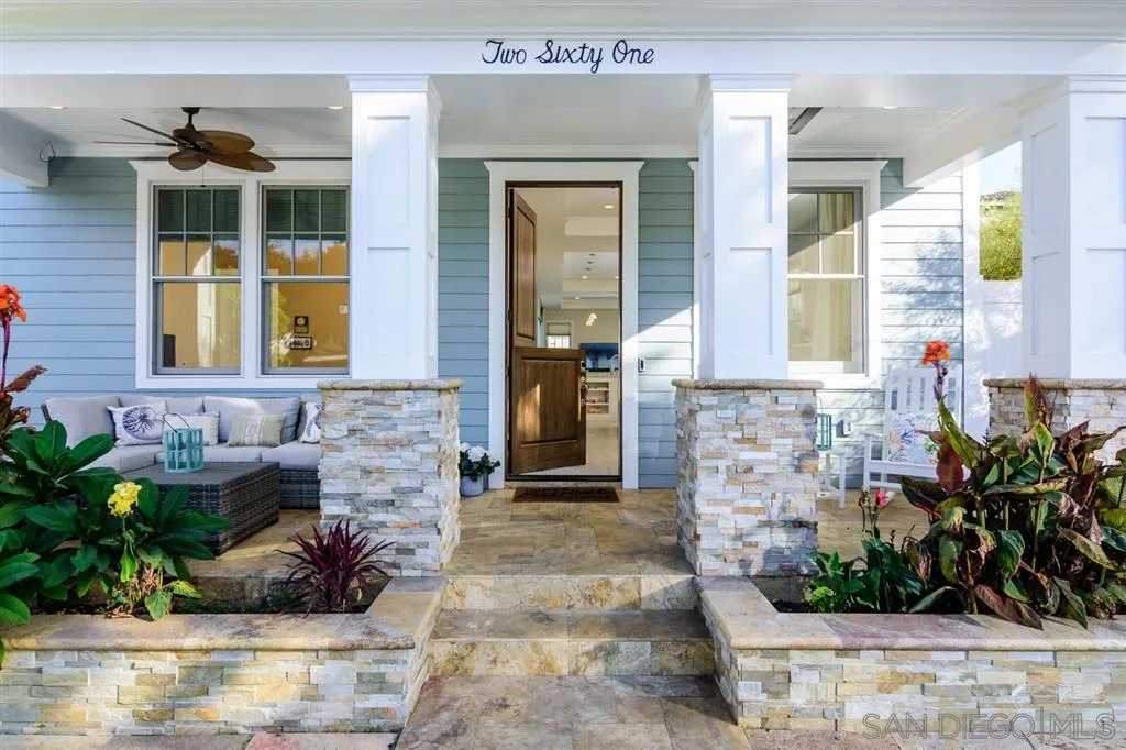 261 E Avenue Coronado, CA 92118 - Photo 2 of 25 a front view of a house with a potted plant