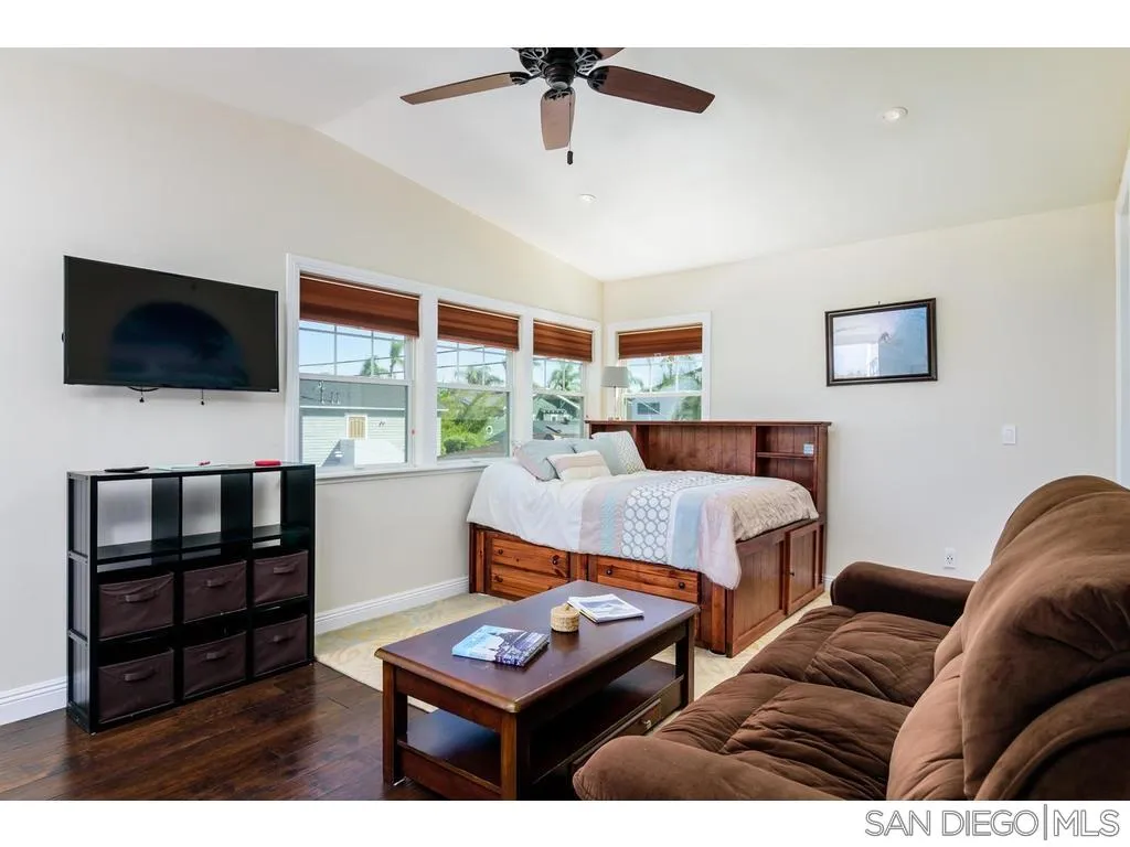 261 E Avenue Coronado, CA 92118 - Photo 24 of 25 a living room with furniture and a flat screen tv