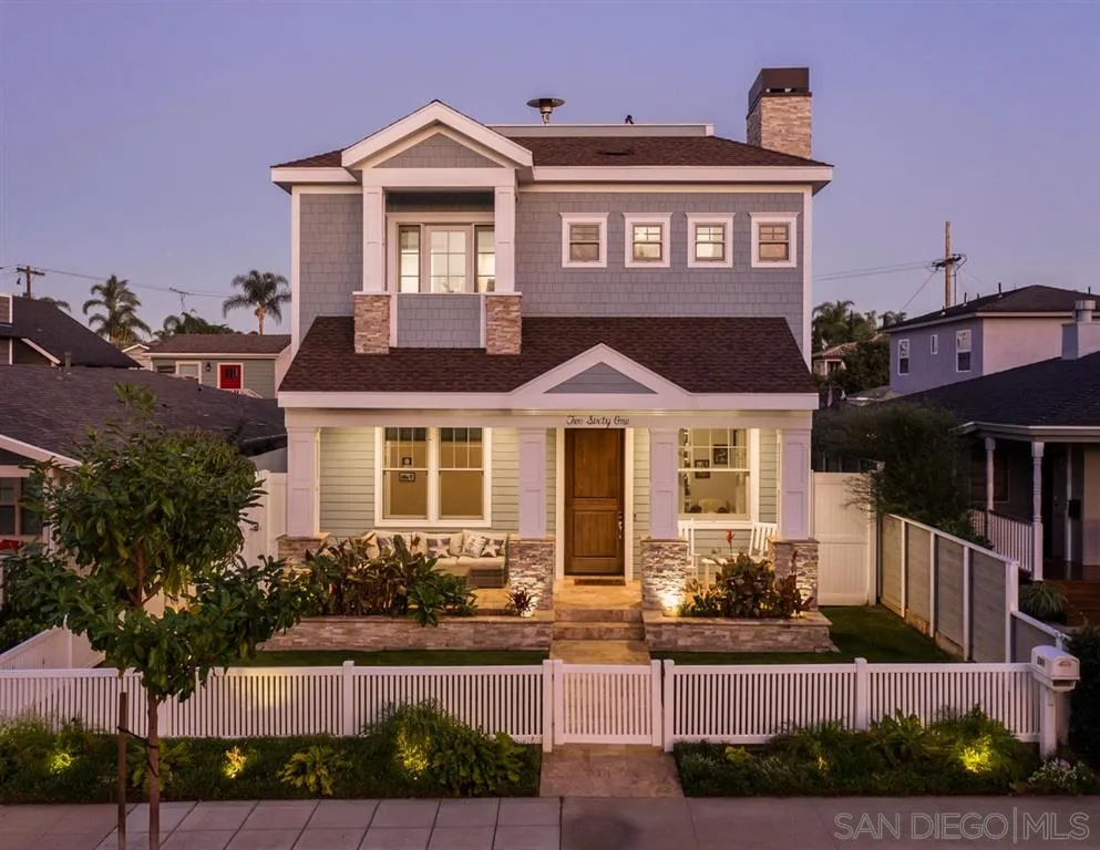 261 E Avenue Coronado, CA 92118 - Photo 3 of 25 a front view of a house with a yard and potted plants