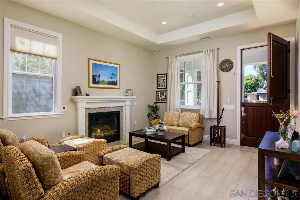 261 E Avenue Coronado, CA 92118 - Photo 4 of 25 a living room with furniture fireplace and window