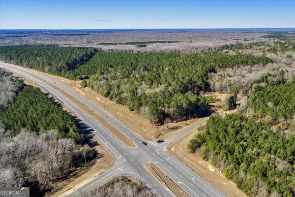 a view of a field with an ocean