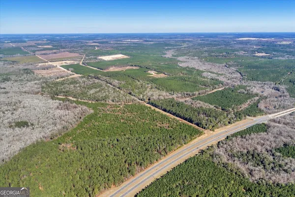 a view of a field with an outdoor space