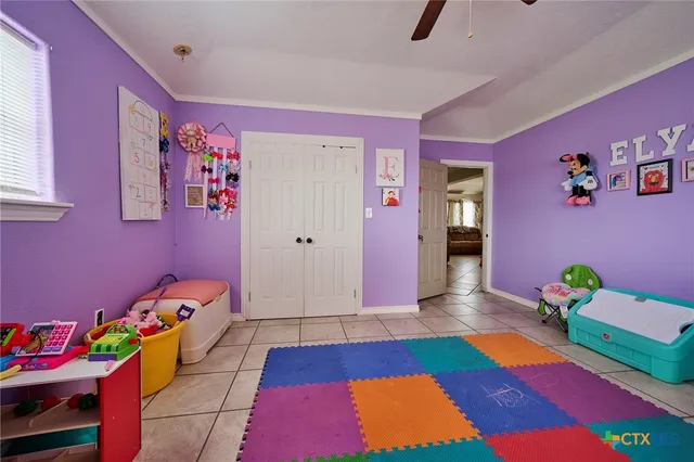 a room with toys and dresser