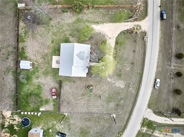 an aerial view of a house with outdoor space