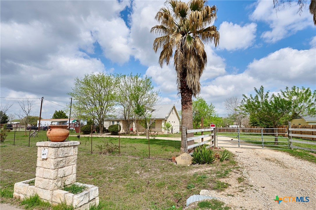 1085 Garrett Trail Maxwell, TX 78656 - Photo 38 of 40 a view of a yard with a fountain