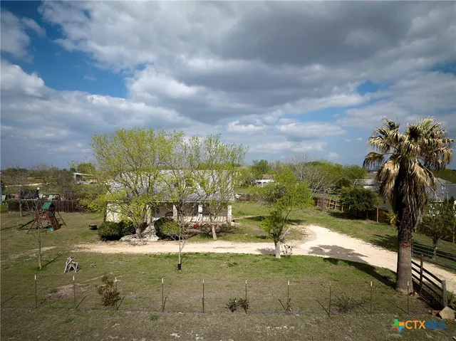 a view of a yard with a fountain