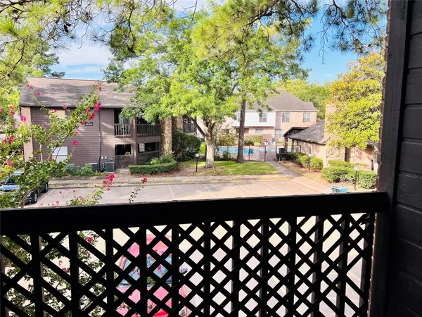 a front view of a house with basket ball court and outdoor seating