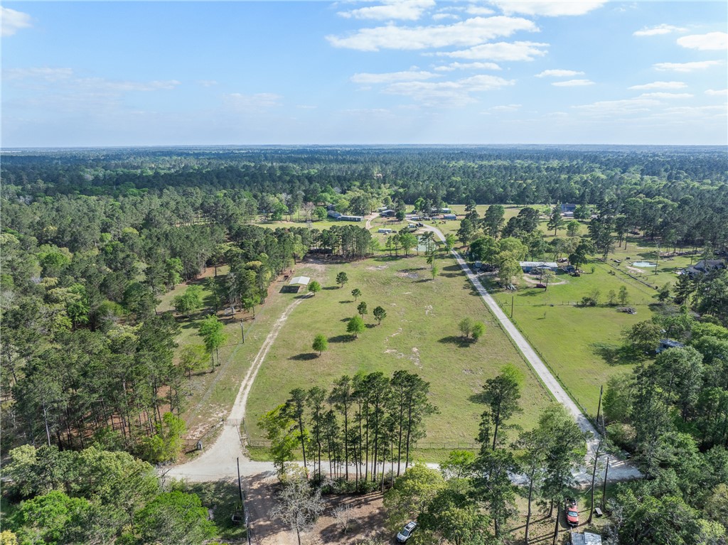 5890 Magan Road Navasota, TX 77868 - Photo 23 of 33 an aerial view of residential building and lake