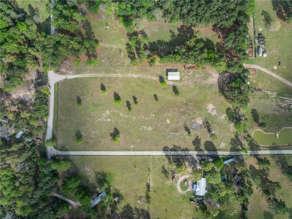5890 Magan Road Navasota, TX 77868 - Photo 31 of 33 an aerial view of a residential houses with outdoor space