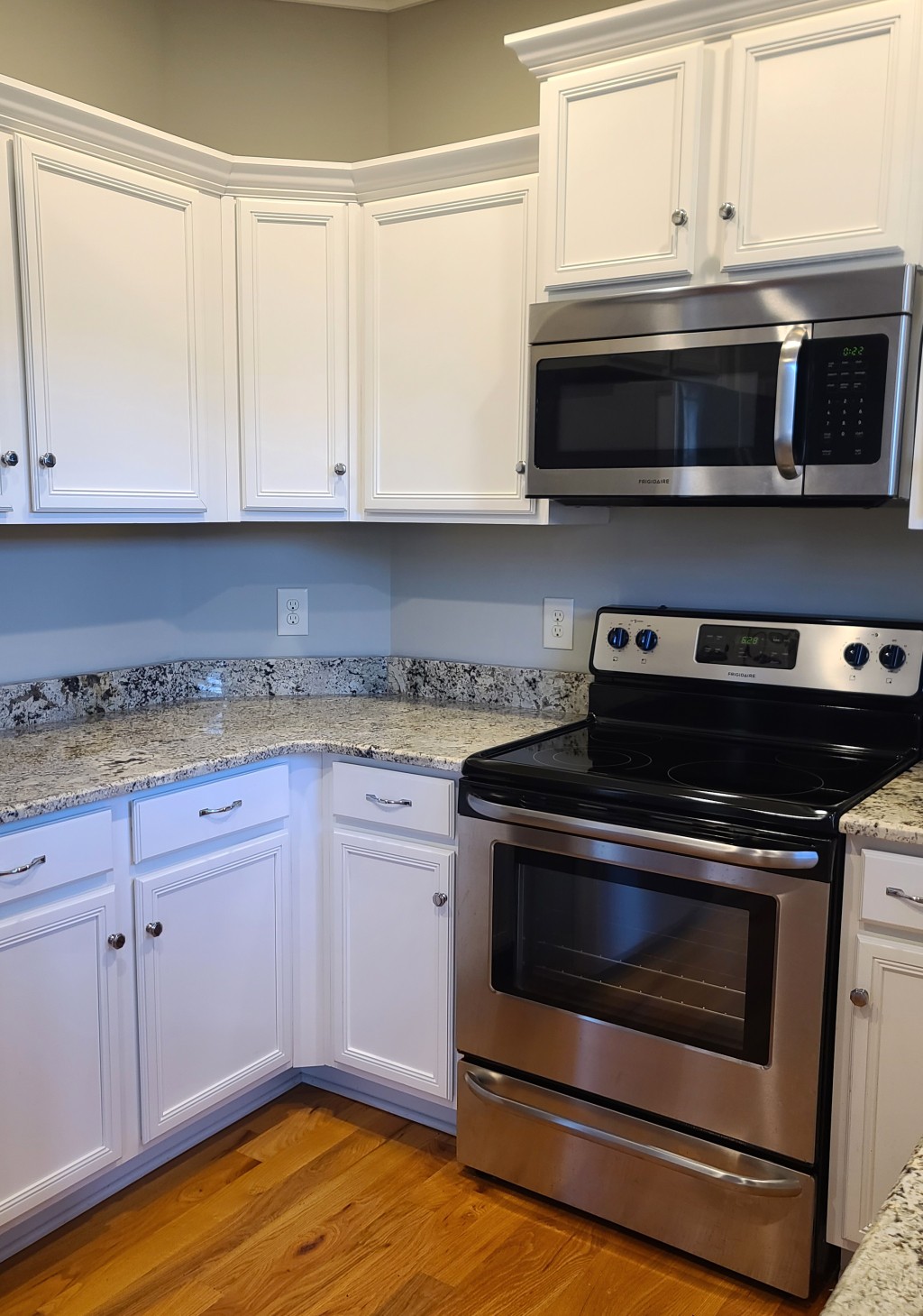 1077 Golf View Way Spring Hill, TN 37174 - Photo 9 of 32 a kitchen with granite countertop a stove and a microwave