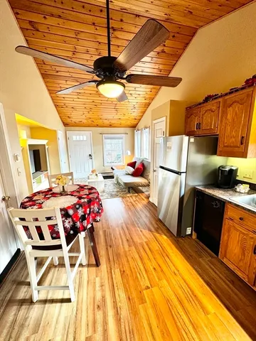 a kitchen view of a table and chairs
