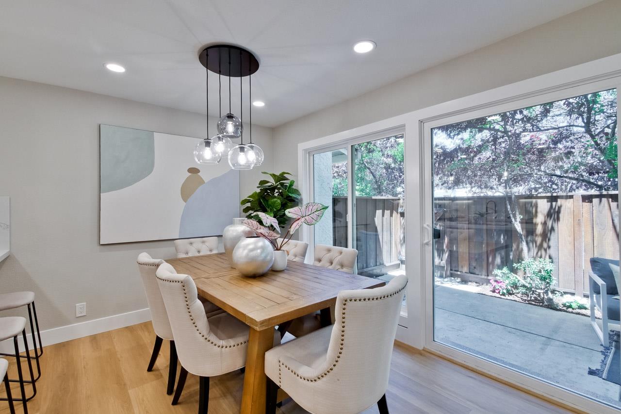 10993 Northsky Square Cupertino, CA 95014 - Photo 11 of 48 a view of a dining room with furniture wooden floor and chandelier