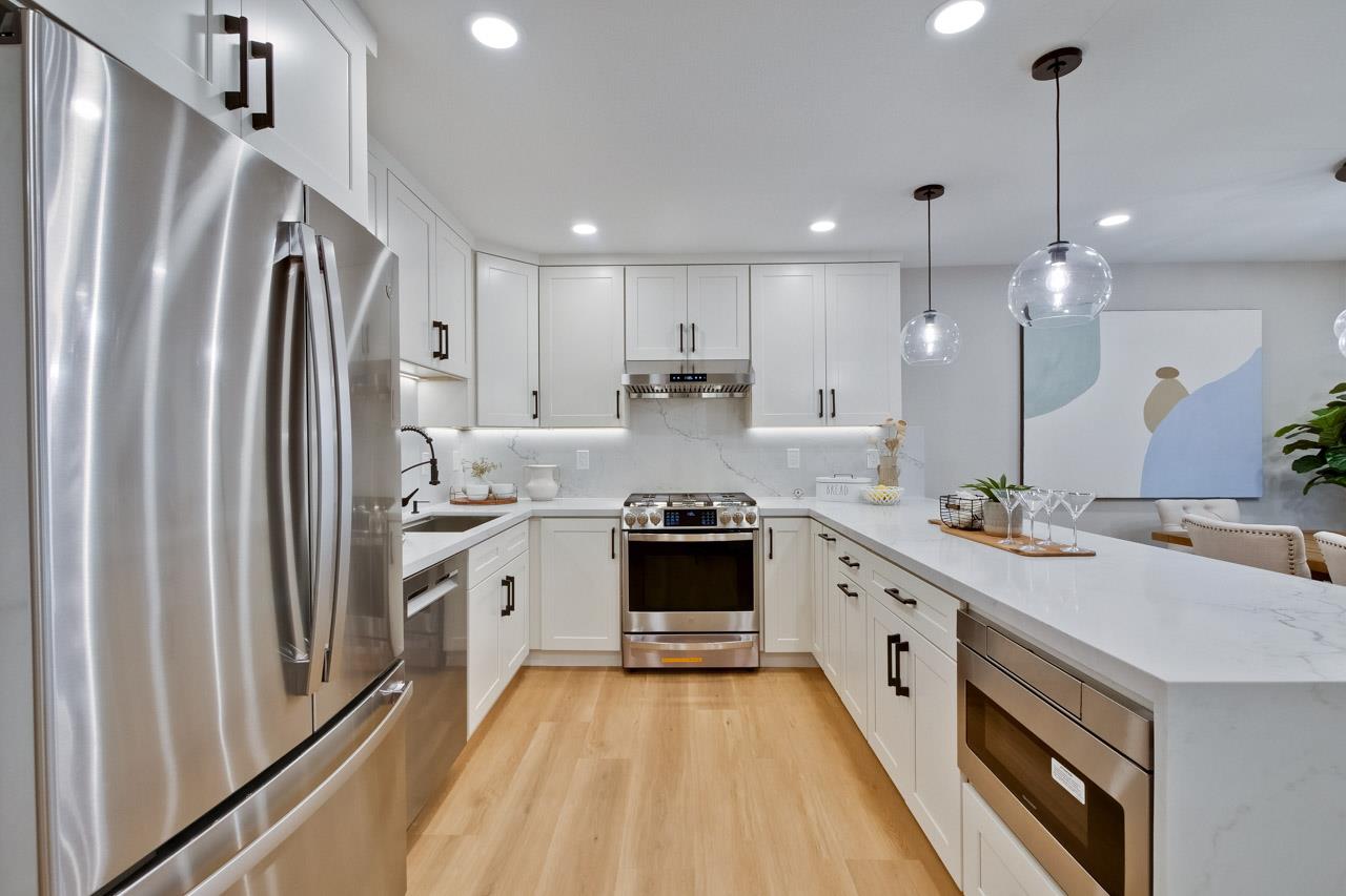 10993 Northsky Square Cupertino, CA 95014 - Photo 18 of 48 a large kitchen with a stove and a refrigerator
