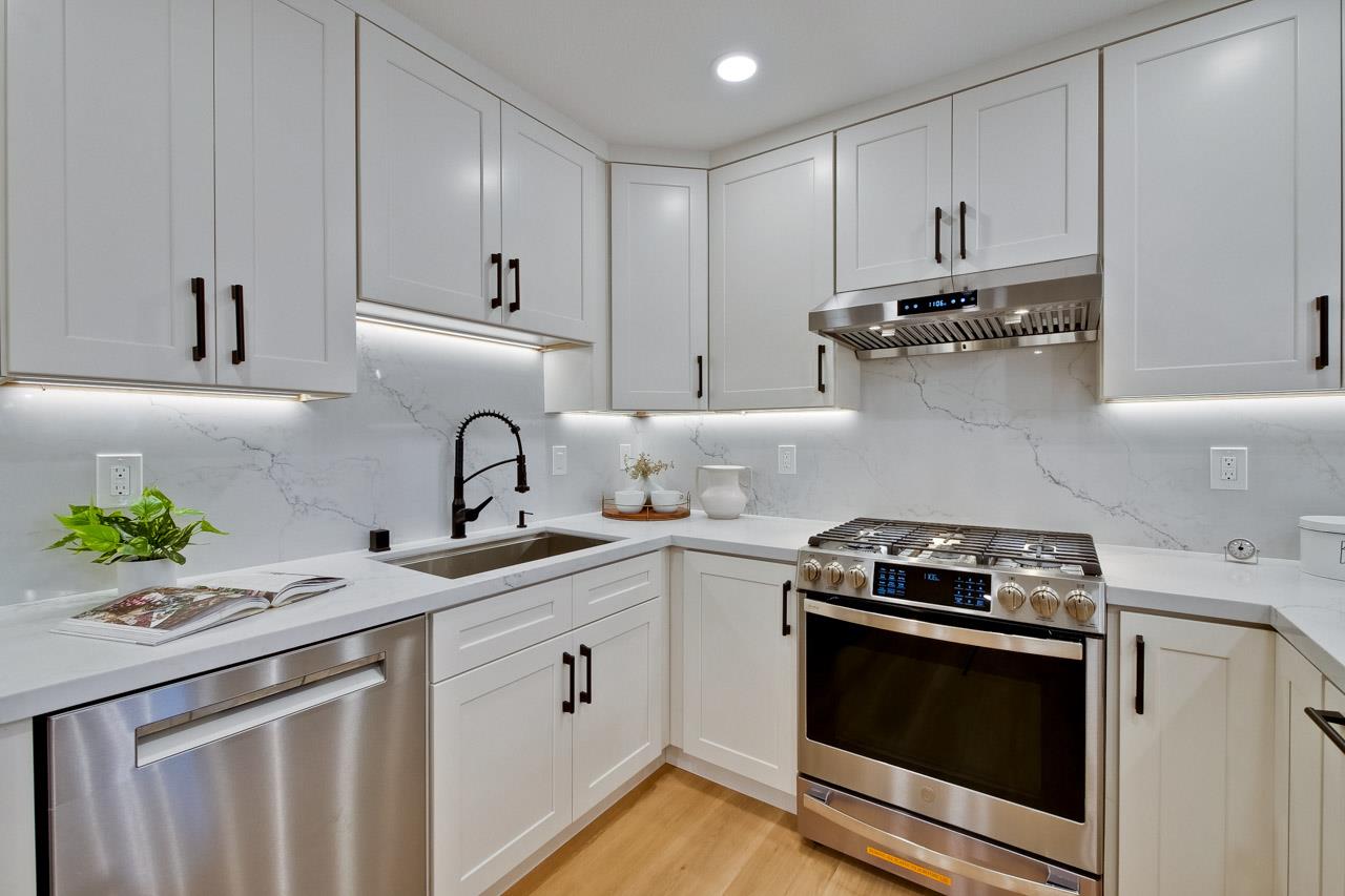 10993 Northsky Square Cupertino, CA 95014 - Photo 19 of 48 a kitchen with appliances a sink and cabinets