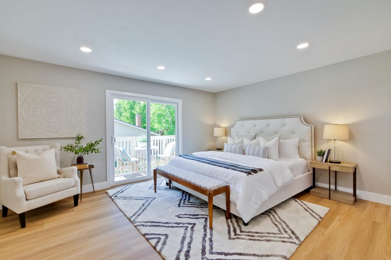 10993 Northsky Square Cupertino, CA 95014 - Photo 21 of 48 a bedroom with a large bed and a couch