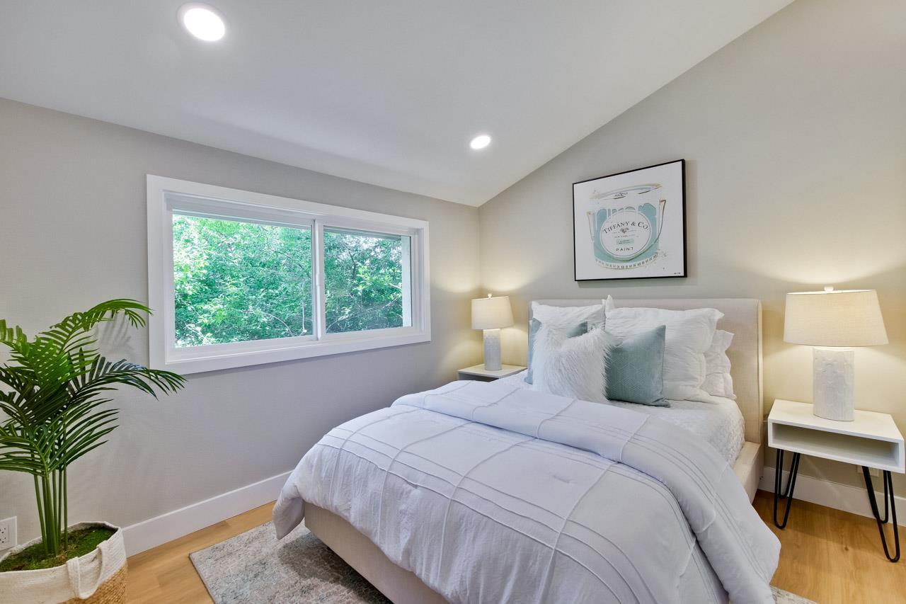 10993 Northsky Square Cupertino, CA 95014 - Photo 30 of 48 a bedroom with bed and a potted plant