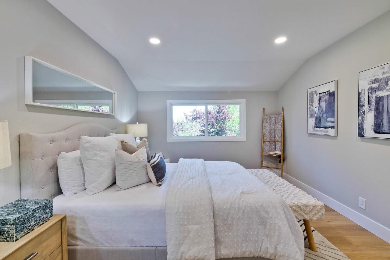 10993 Northsky Square Cupertino, CA 95014 - Photo 34 of 48 a bedroom with a bed and a couch