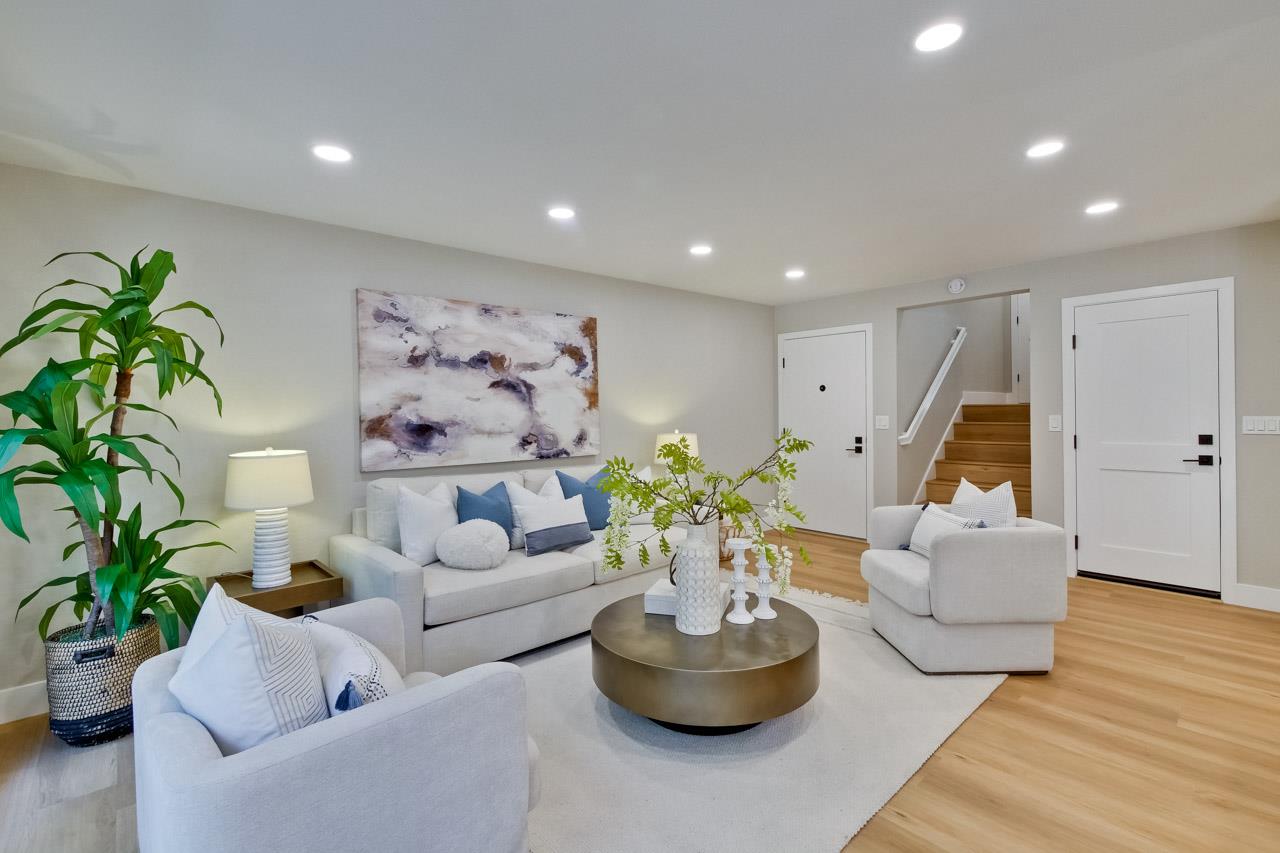 10993 Northsky Square Cupertino, CA 95014 - Photo 4 of 48 a living room with furniture and a potted plant