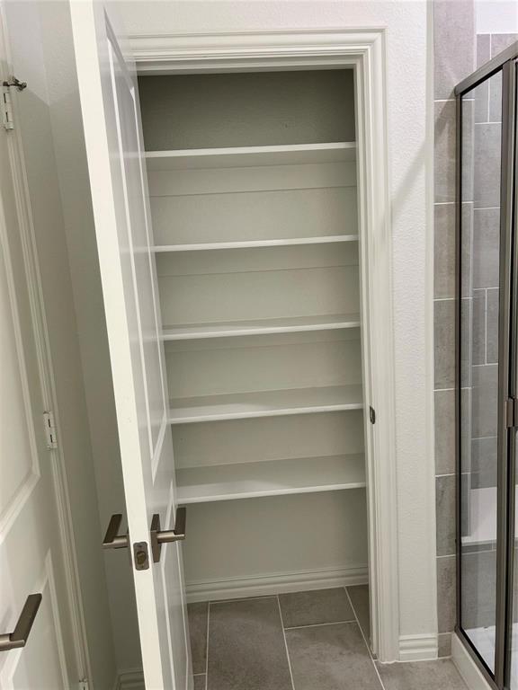 4704 Craymore Road Dallas, TX 75228 - Photo 6 of 14 a view of walk in closet with empty racks